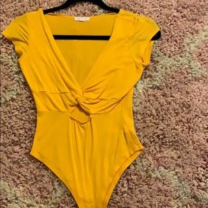 Yellow bodysuit from A’GACI